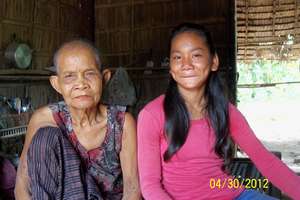 Kay & grandmother inside their house