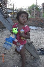 Lo Ud-age 4-stands before her house