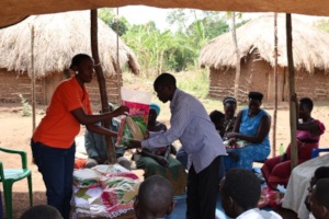 Beneficiaries receiving seeds for planting