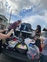 giving clothes to people that loose everything