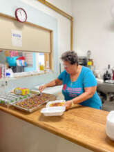 Serving meals for the people in need.
