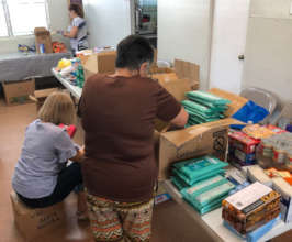 Volunteers sorting donations