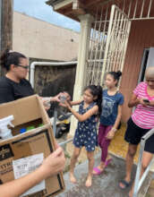 family receiving supplies