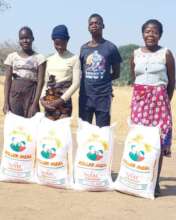 Distribution of ground maize to orphans