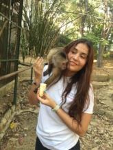 SAI Zoo Keeper Affectionately Feeds Adult Monkey
