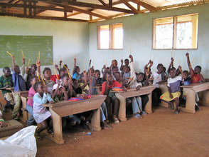 proudly waving donated pencils