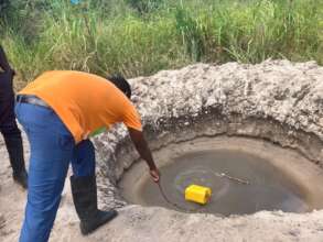 Villager demonstrates water collection
