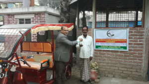 Distributing Auto Rickshaw to unprivileged People