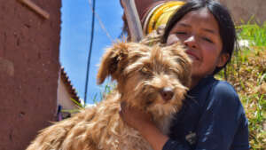 One of the rescued puppies and his owner
