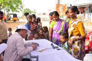 Mothers signing up their children for drops