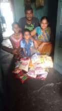 A family in New Delhi receiving food rations