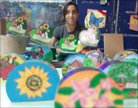 Painter with her creations