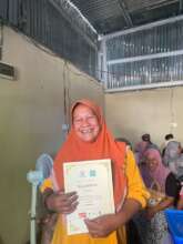 Happy faces of residents with their certificates