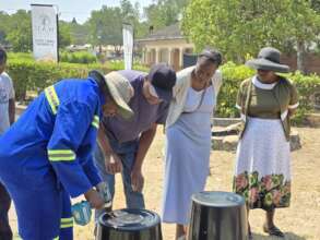 Women Making A Vermicomposting Bin