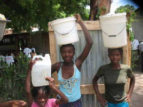 Girls carrying clean water