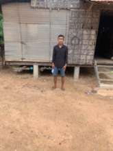 Saron standing in front of his house at Siem Reap