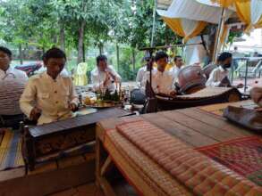 They are playing at a ceremony in the communities