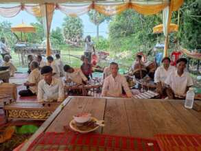 Tola is playing traditional music at a villager