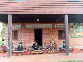 Tola rehearsing music with his classmates at SCC