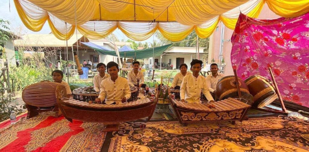 Phimly performs Khmer traditional music at the vil
