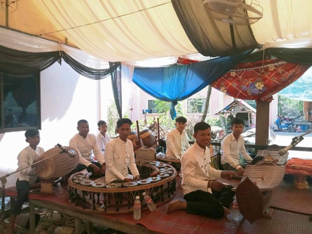Phimly performs Khmer traditional music at the vil