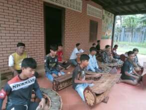 Tola practices the music at SCC