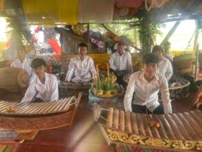 Yuth and team memebrs at villager's ceremony