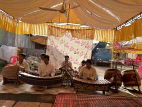 Yuth was playing the music at villager's ceremony