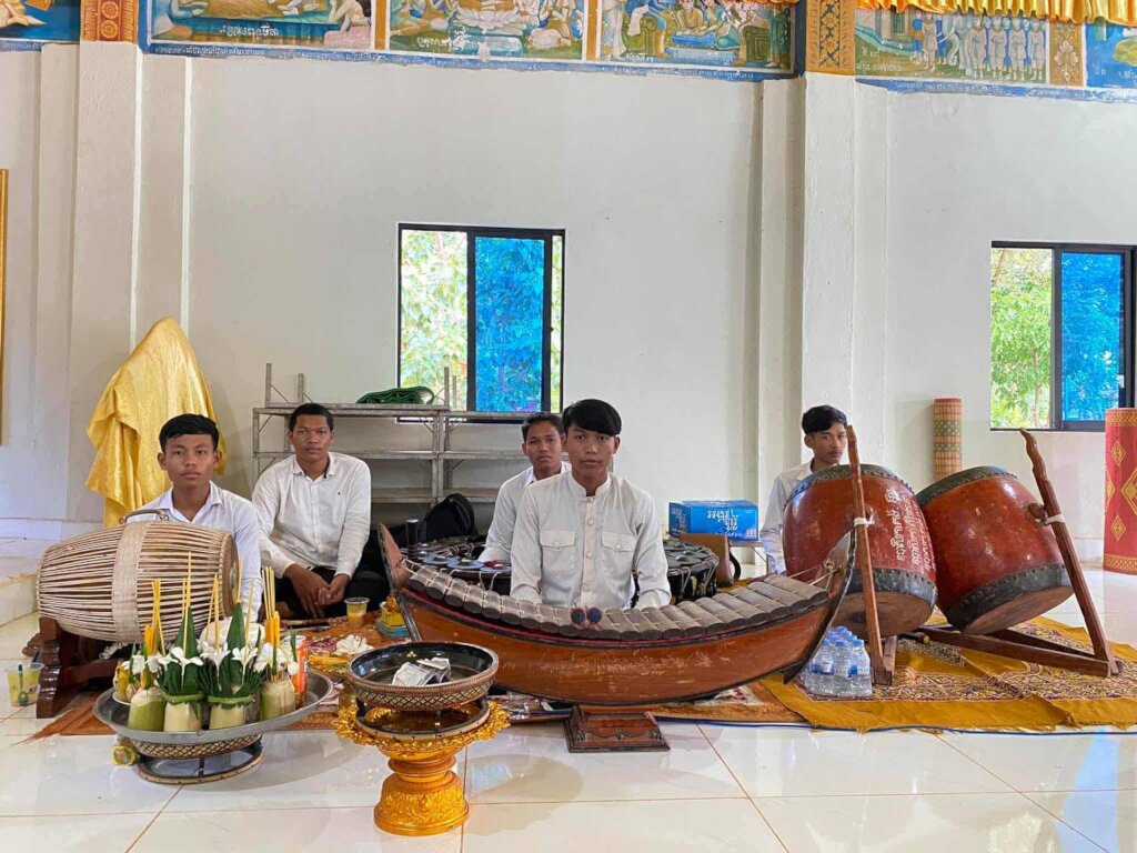 Yuth performs traditional Khmer music during a vil
