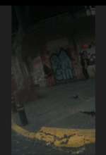 Trans woman in the corner waiting for a client