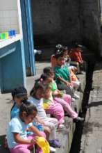 Partners teach kids to wash hands & brush teeth