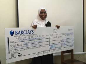Our student, Ashrina, receiving a funding award