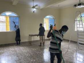 Students help cleanup after school painting