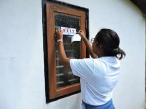 Emergency stickers placed on houses and vehicles
