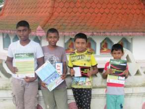 Children with the leaflets handed out at the event