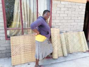Agnes Mohlabe of Phafogang makes mats from reeds