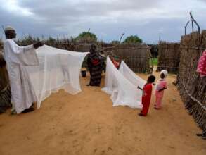 Family reaches home with their new mosquito nets