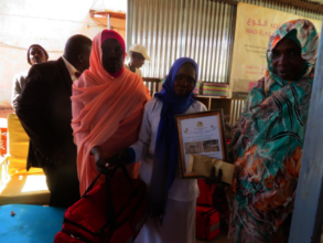 Munira Receiving her Certificate and Midwifery Kit