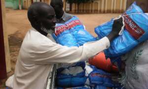 Mosquito nets being unloaded