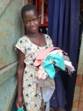 Happy recipient of a clothing donation