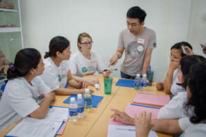 A trainer demonstrates disinfection