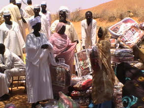 Distributing the blankets and mosquito nets
