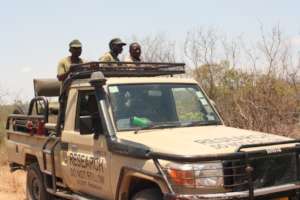 ALERT staff attending meeting with villagers