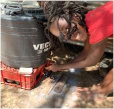 11 year old girl demonstrates hand washing.