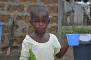 Nadit's classmate eating porridge served at school