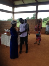 Akosua receiving supplements from Jesse.