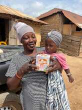 Moro and child with her breastfeeding award