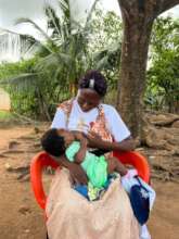 Ramatu breastfeeding her child