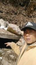 Local guide pointing to water source