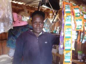 Christine Mwari in her kiosk, Mituntu